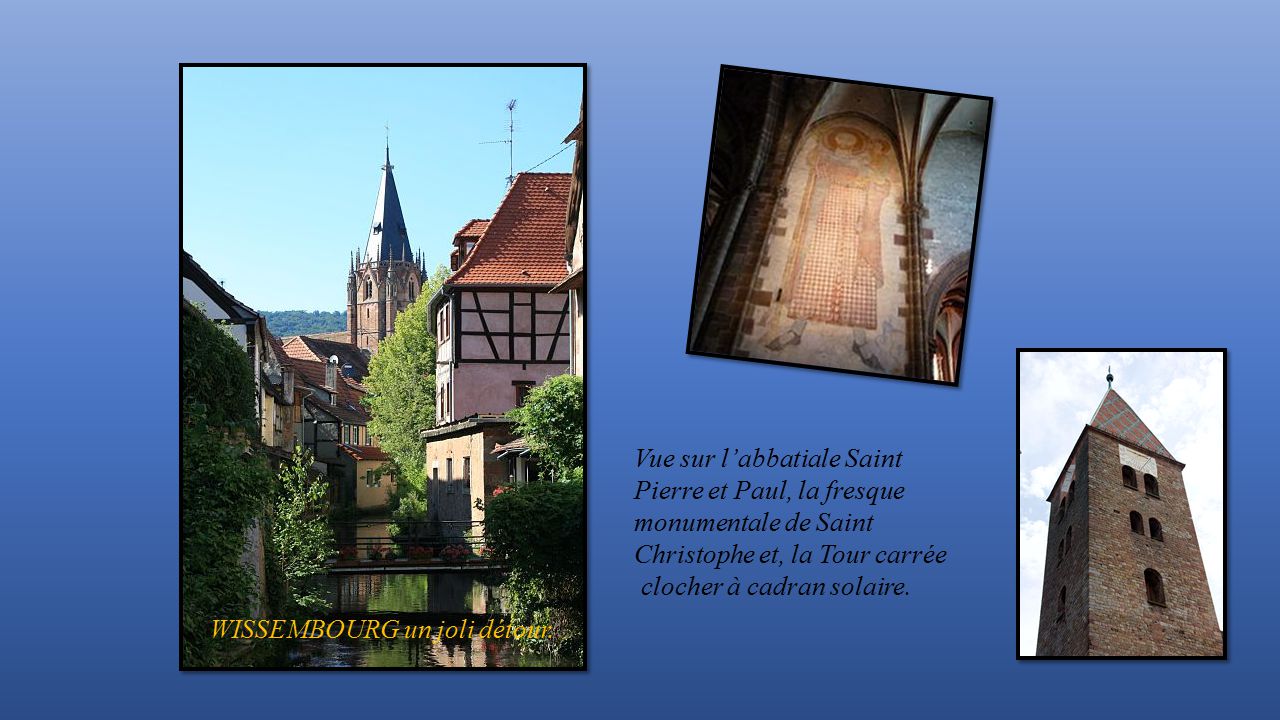 Vue sur l’abbatiale Saint Pierre et Paul, la fresque monumentale de Saint Christophe et, la Tour carrée