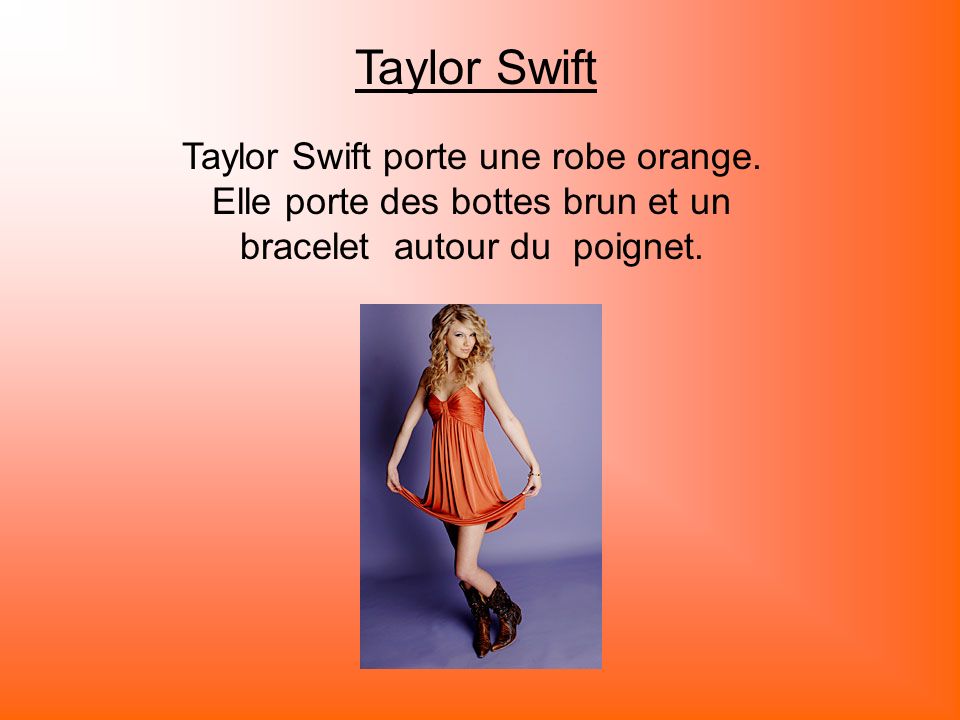 Taylor Swift Taylor Swift porte une robe orange.